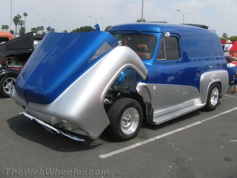 1968 Ford Mustang - This customized van features a two-tone blue and silver paint scheme and its hood is open, revealing the engine compartment.