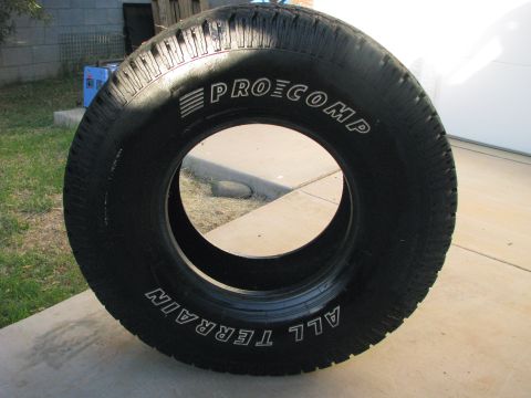 2008 Ford Bronco - Pro Comp All Terrain tire shown outdoors on a concrete surface.