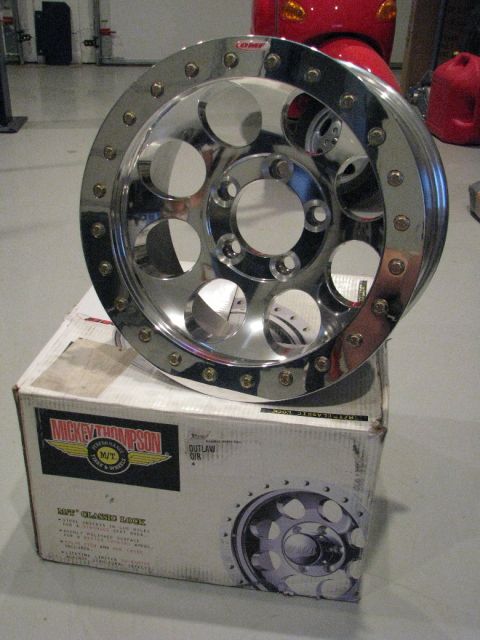 2008 Ford Bronco - A chrome Mickey Thompson wheel is displayed on its original packaging, which features product details and an image of the wheel.