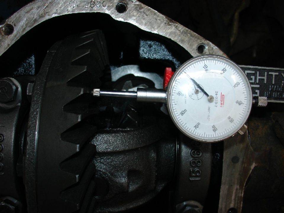 Differential gears with a dial indicator measuring backlash
