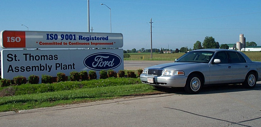 Silver 2001 Ford Crown Victoria parked near St. Thomas Assembly Plant sign