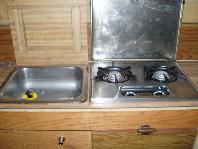 RV kitchen counter with sink and stovetop
