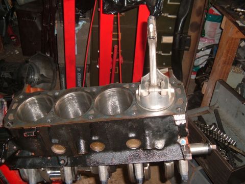 1981 Ford LTD - Using a piston to square the rings so I can check the end gaps. They were fine.