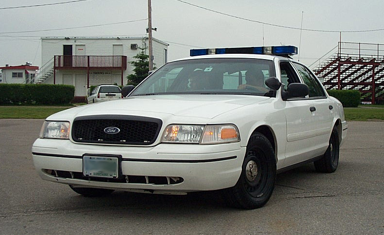 White police car, 3/4 front view