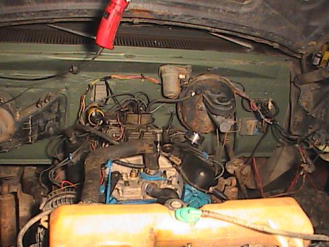 1980 Dodge Magnum - Close-up view of a V8 engine bay, showing the carburetor, hoses, and wiring.