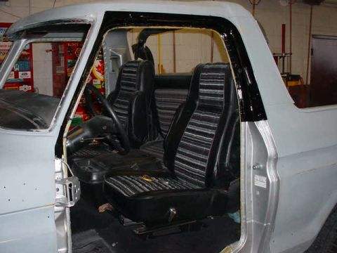 1979 Ford Bronco - The interior of a 1978 Ford Bronco shows its distinctive striped upholstery and dashboard details.