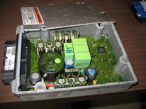 1995 Ford C-350 (Centurion Conversions) - Open Ford electronic control module showing internal components and circuit board.