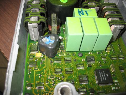 1995 Ford C-350 (Centurion Conversions) - Close-up of an electronic control unit, showing intricate circuitry and various electronic components.