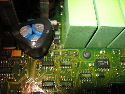 1995 Ford C-350 (Centurion Conversions) - Close-up view of electronic components on a circuit board, including capacitors and integrated circuits.