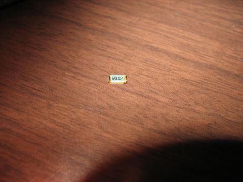 1995 Ford C-350 (Centurion Conversions) - A small electronic component labeled with the number 6042 is shown on a wooden background.