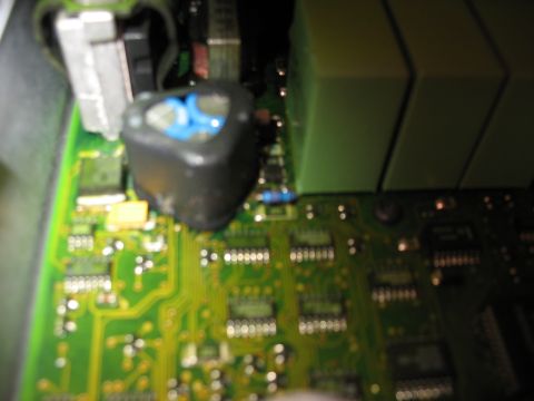 1995 Ford C-350 (Centurion Conversions) - Close-up view of a green circuit board with various electronic components, including an inductor and capacitors.