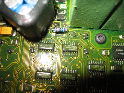 1995 Ford C-350 (Centurion Conversions) - A detailed view of electronic components on a circuit board, including multiple chips and a resistor.