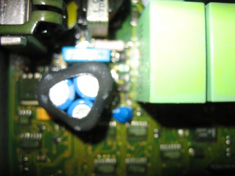 1995 Ford C-350 (Centurion Conversions) - Close-up view of electronic components on a circuit board, including capacitors and relays.