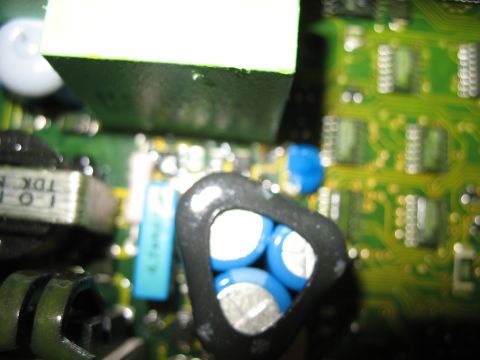 1995 Ford C-350 (Centurion Conversions) - Close-up view of electronic components on a circuit board, including blue capacitors and a TDK transformer.