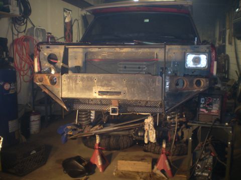 1986 Ford Bronco - This vehicle's front end is disassembled, showing the grille area and headlights, suggesting it is undergoing repairs or modifications in a…