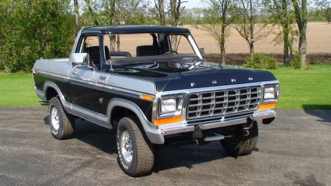 1979 Ford Bronco - This 1979 Ford Bronco features a two-tone black and silver paint scheme with a chrome grille.