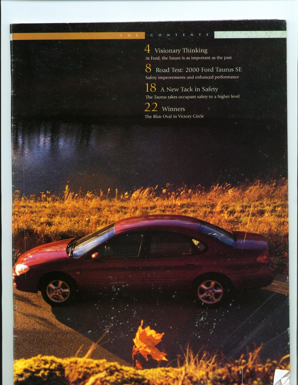 Magazine contents page with a red Ford Taurus sedan at dusk