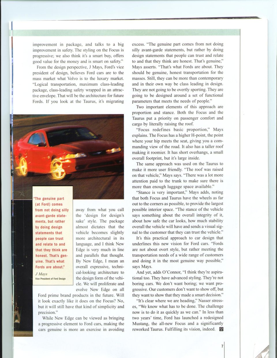 Magazine article page with a red sports car photographed in motion