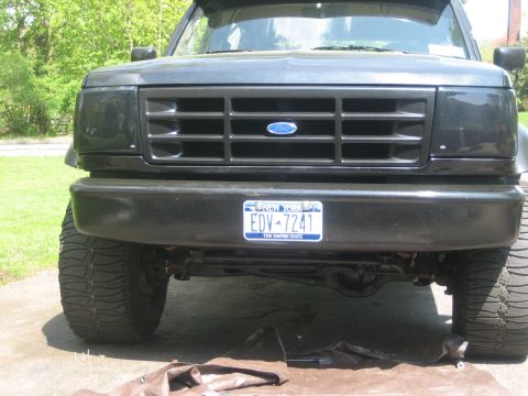 1995 Ford Bronco - Front view of a black Ford Bronco, its grille and license plate.