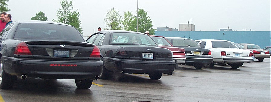 Rear view of a black 2001 Ford Crown Victoria Marauder with dual exhaust
