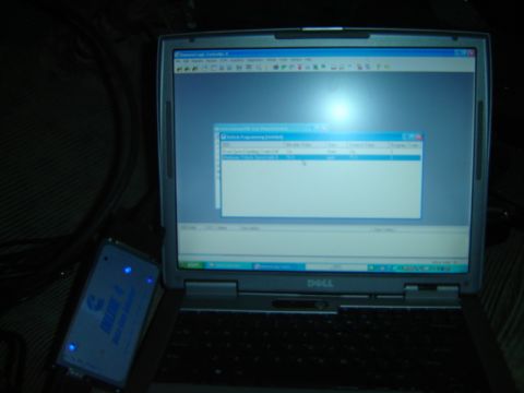 1992 Ford Bronco - Laptop running diagnostic software, likely for vehicle programming, next to a diagnostic tool.