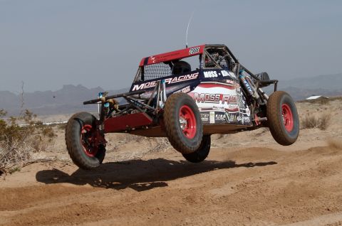2008 Ford Bronco - This off-road buggy, marked with "2008" on its roof, is captured mid-air during a race.