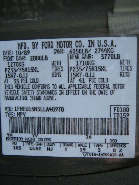 1990 Ford Bronco - Vehicle identification sticker shows manufacturing date of October 1989.