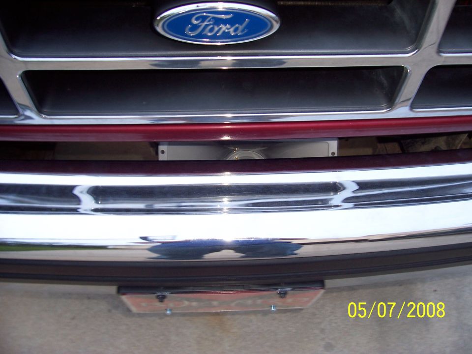 Chrome Ford grille and front bumper close-up with date stamp