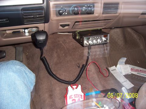 1994 Ford Bronco - Interior view of a vehicle's dashboard showing a CB radio and microphone installation.