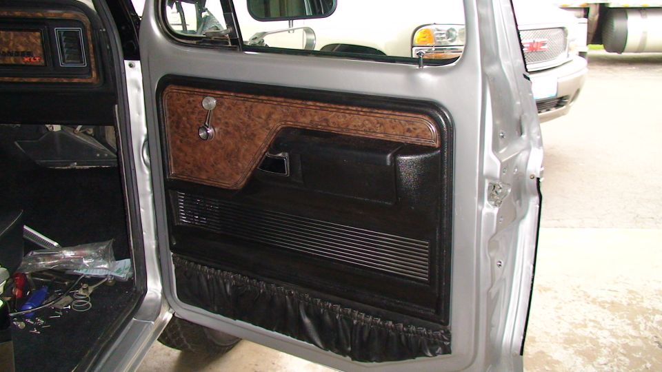 1979 Ford Bronco interior door panel with wood grain trim