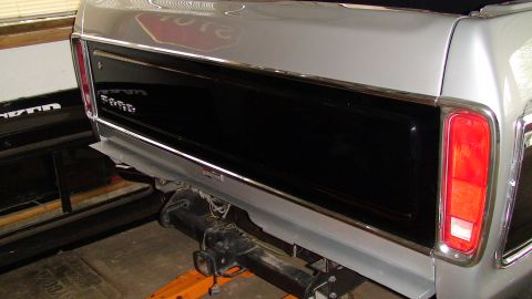 1979 Ford Bronco - Rear view of a 1979 Ford Bronco, showing the tailgate and trailer hitch assembly.