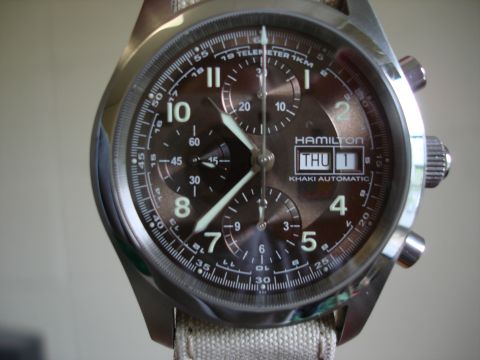 1994 Ford Bronco - Close-up of a Hamilton Khaki Automatic watch, showing the dial with hour markers, hands, and date display.
