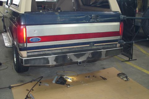 1993 Ford Bronco - Rear view of a 1993 Ford Bronco, showing the tailgate and bumper assembly.