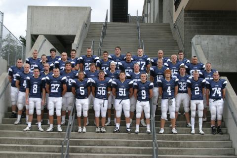 1993 Ford Bronco - A football team stands on concrete stadium stairs for a team photo.