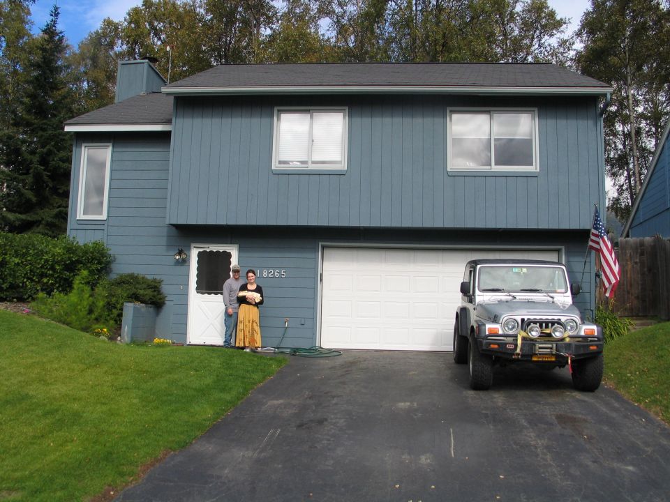 Silver 2003 Jeep TJ front view parked in driveway