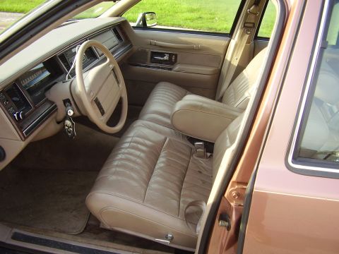 1996 Ford F-150 - Interior of a 1992 Lincoln Town Car, tan leather seats and dashboard details.