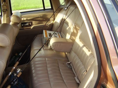 1996 Ford F-150 - Fishing rods and tackle are stored in the back seat of this vehicle.
