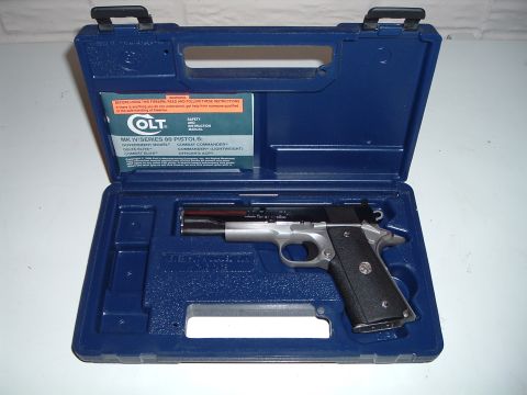 1995 Mercury Grand Marquis - Colt MK IV Series 80 pistol and safety manual inside its original blue case.