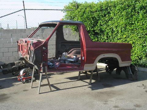1986 Ford Bronco - Body shell of a Ford Bronco, likely from the 1980s, undergoing restoration work.