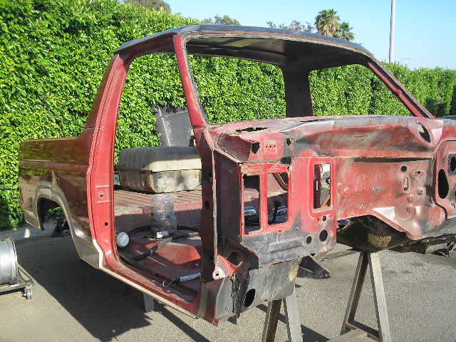 1986 Ford Bronco body, red, 3/4 front view, on stands