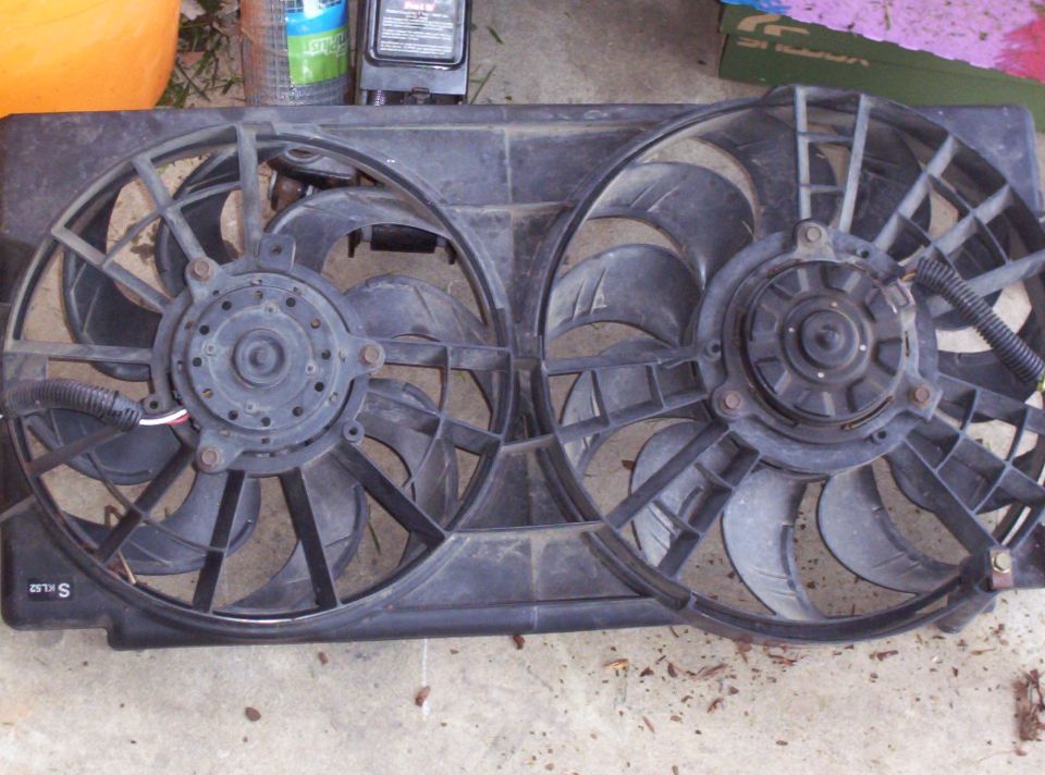 Dual radiator fans with black plastic shroud, wires visible