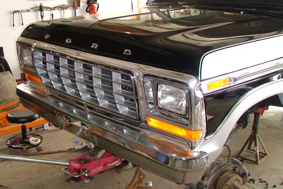 Front of a 1979 Ford Bronco with a chrome grille and headlights