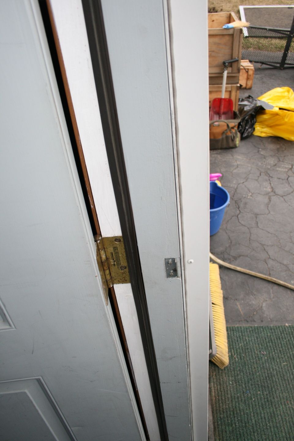 Door hinge with visible text on a white door