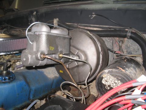 1979 Ford Bronco - Close-up view of the brake booster and master cylinder assembly.