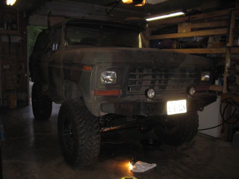 1979 Ford Bronco - This lifted Ford Bronco, likely a 1978 model, is parked indoors with a camouflage paint scheme.