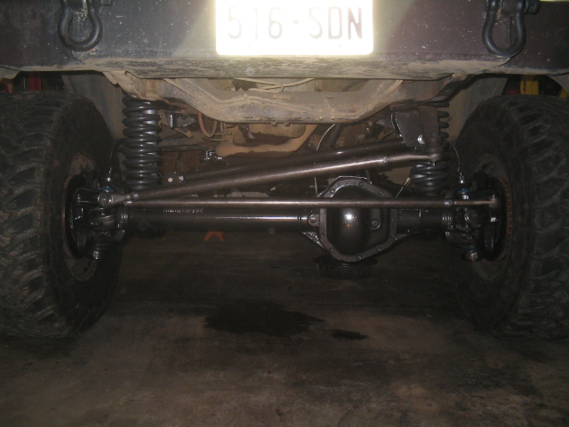 Rear axle, suspension, and tires of a modified vehicle with license plate 516-SDN
