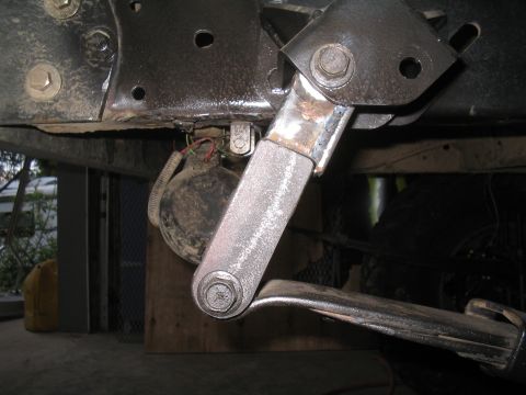 1979 Ford Bronco - A close-up view of a vehicle's suspension system and a horn, with no clear year identification.