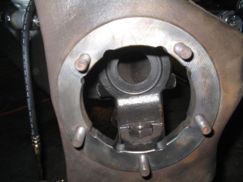 1979 Ford Bronco - Brake caliper bracket assembly with attached brake hose.