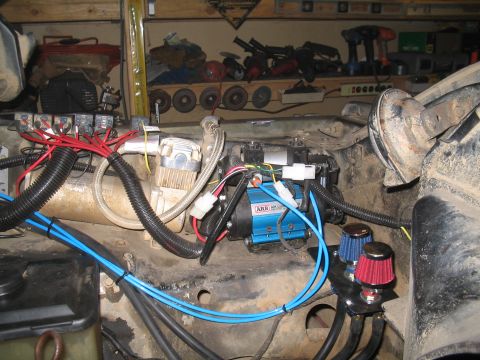 1979 Ford Bronco - Engine bay shows ARB air compressor, relays, and air filters installed.