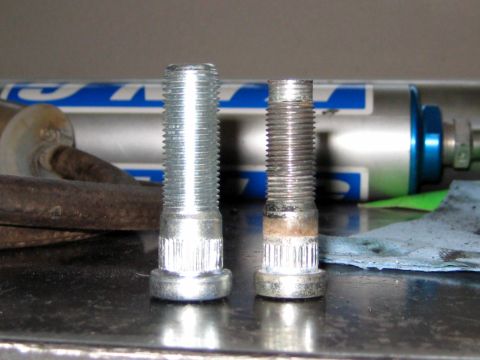 1996 Ford Bronco - Comparison of a new wheel stud next to a used and corroded one.